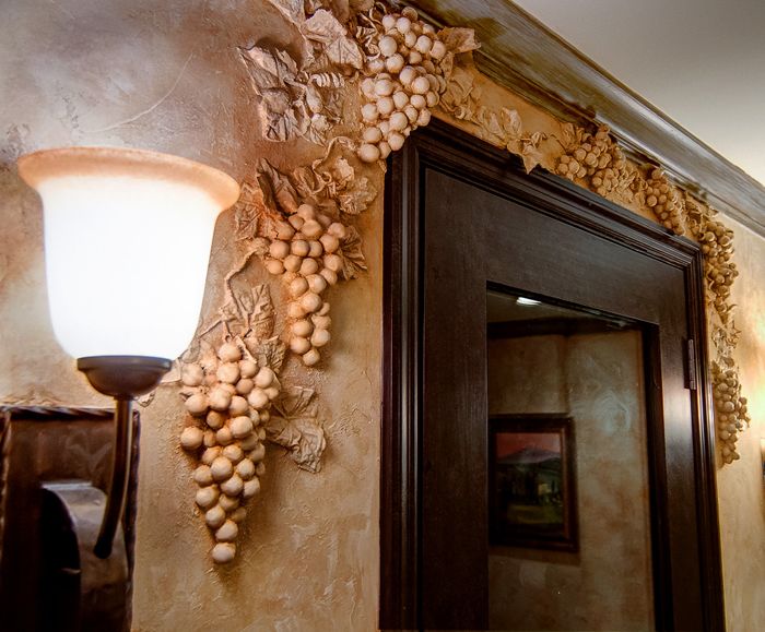 Faux Chiseled Grape Motif added around this wine room entry