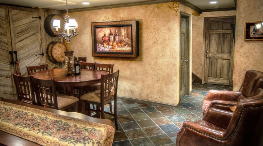 Wine Room Makeover Tuscan plaster walls chiseled grape motifs and faux finished barn siding trim and doors